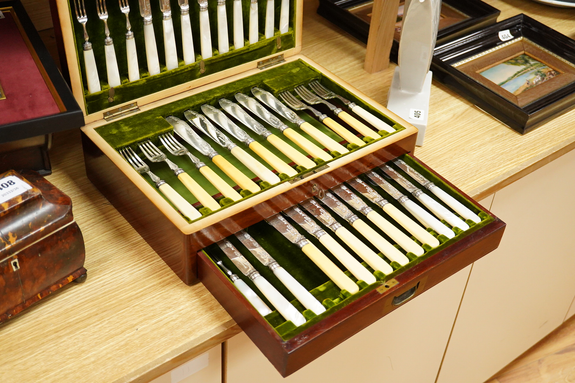 A set of six late Victorian bone handled fish knives and forks and a set of twelve mother of pearl handled dessert knives and forks, mahogany cased